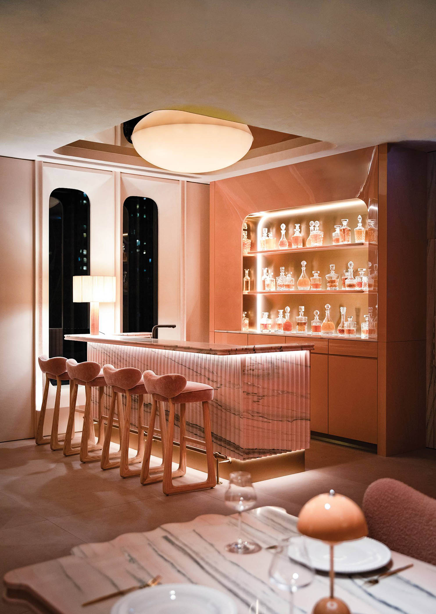 A bar with a bar stool and a table.