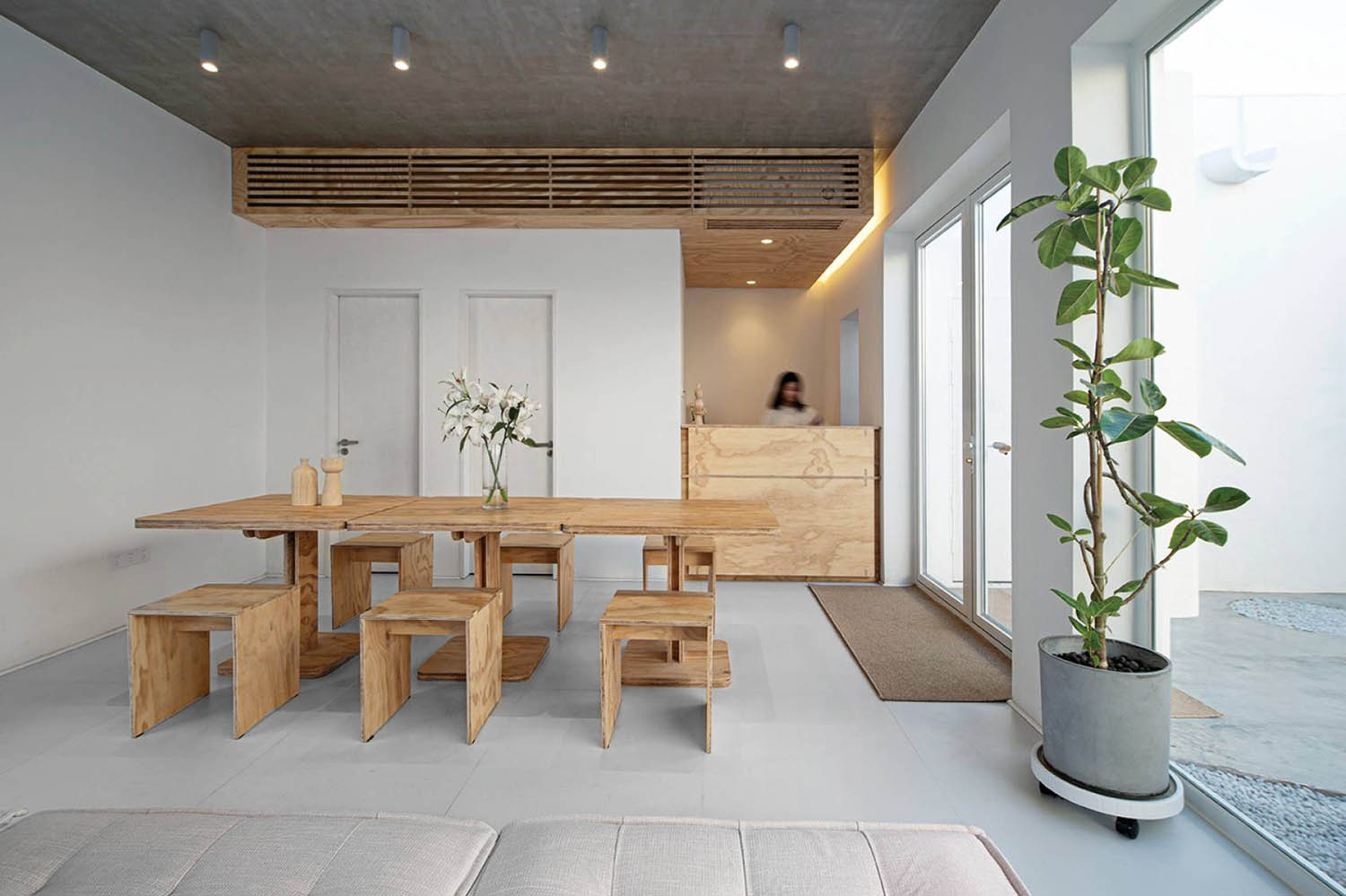 A wooden table and chairs in a room.