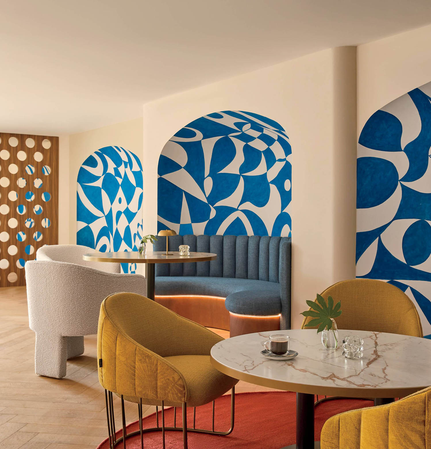 A room with blue and yellow walls and chairs.