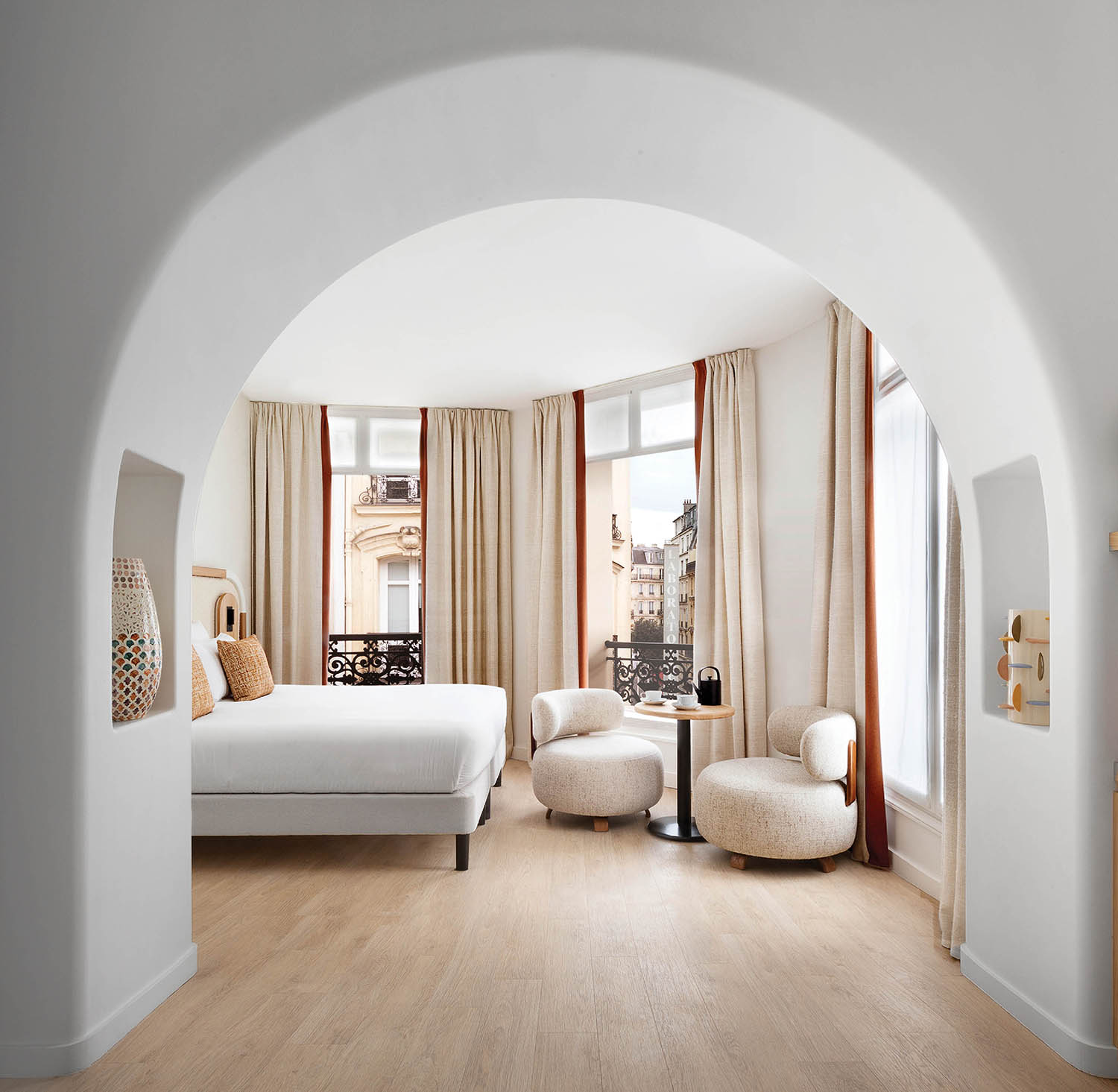 A bedroom with a bed and a chair.