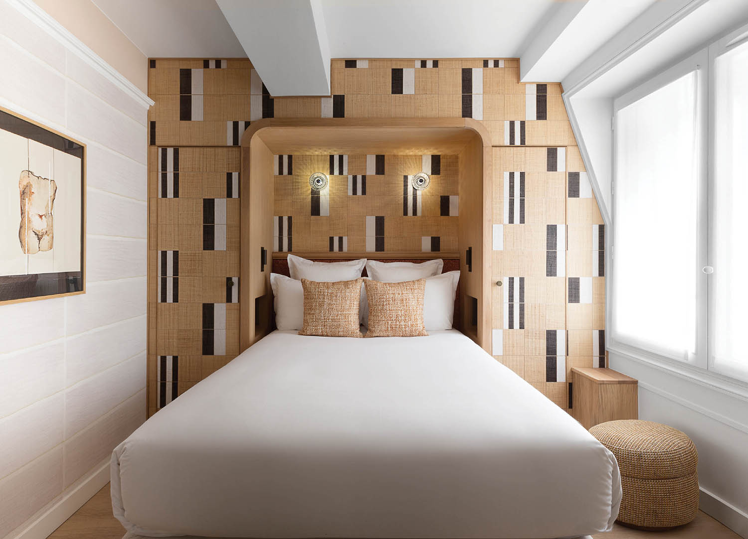 A bed in a room with a wall of wood.