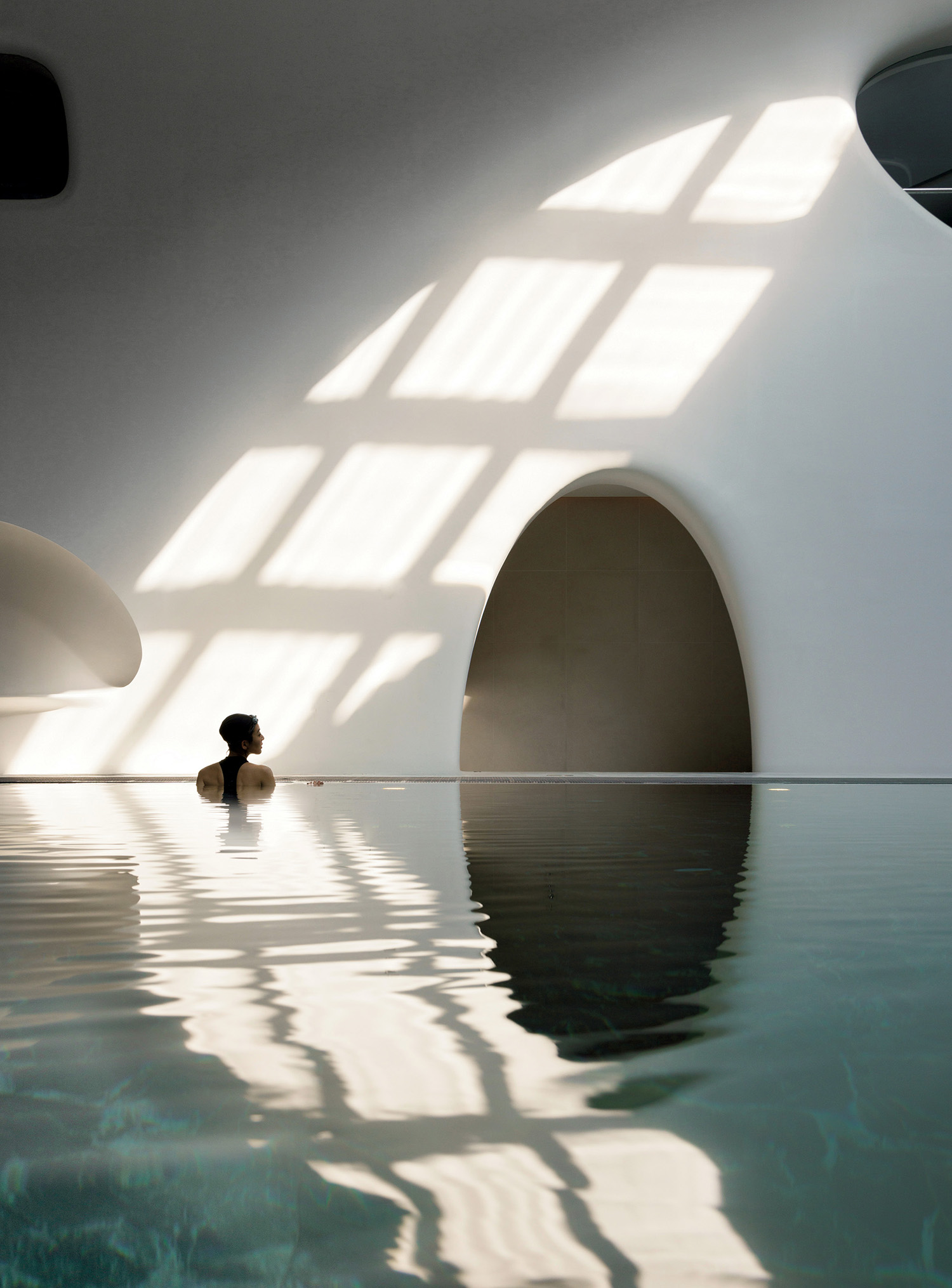 A person in a pool with a camera