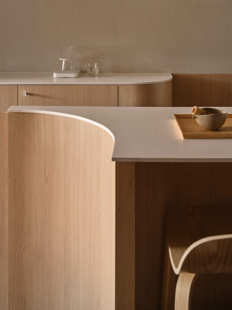 a curved wooden cafe counter in bruno coffee