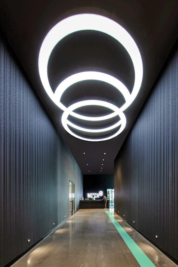 Custom light fixtures outside the fitness center.