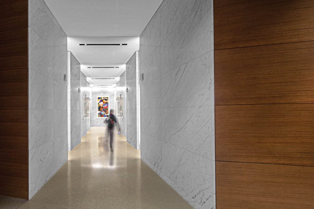 Carrara-clad walls in the main elevator lobby.