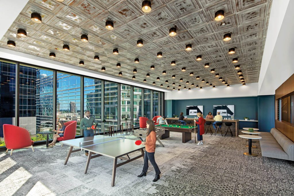 Tin-plated ceiling panels and Donna Piacenza’s flush-mount fixtures bring a vintage vibe to the game room.