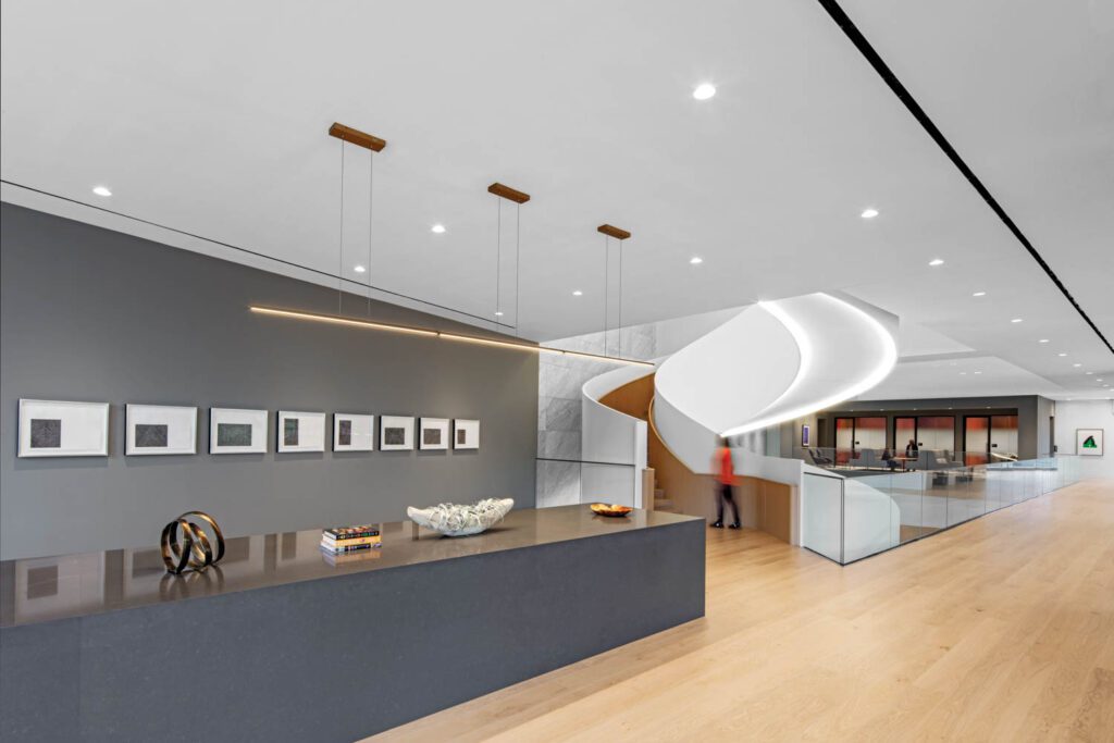 The stair begins on the second level, which is populated by various flex and gallerylike spaces united by white oak flooring.