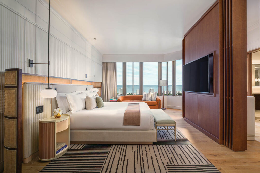 a guest room with floor-to-ceiling windows