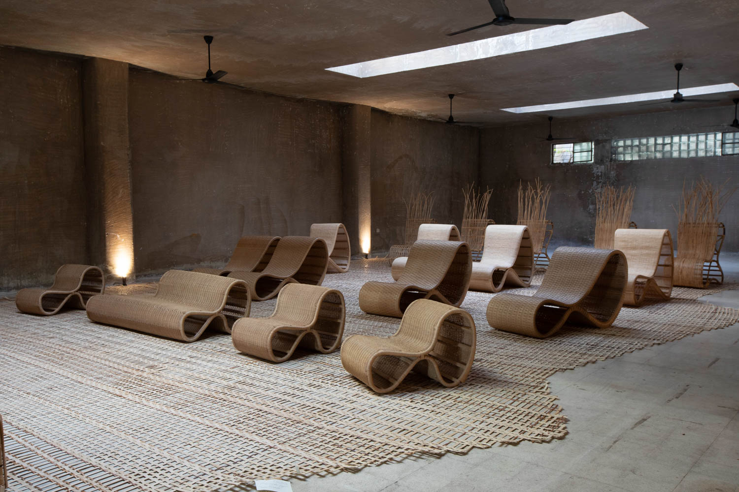 a series of rattan chairs with curved shapes