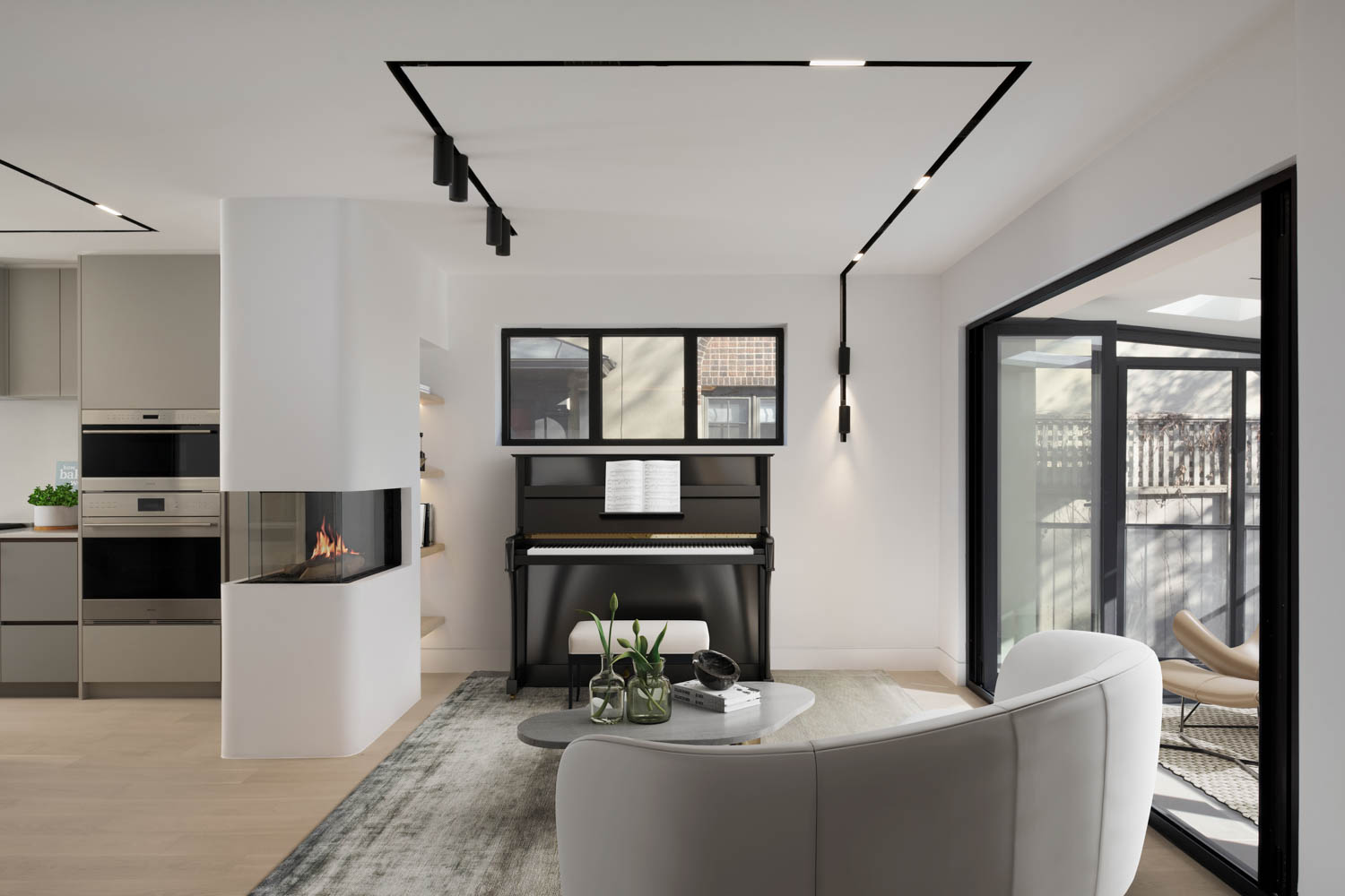 piano in room facing the sunroom