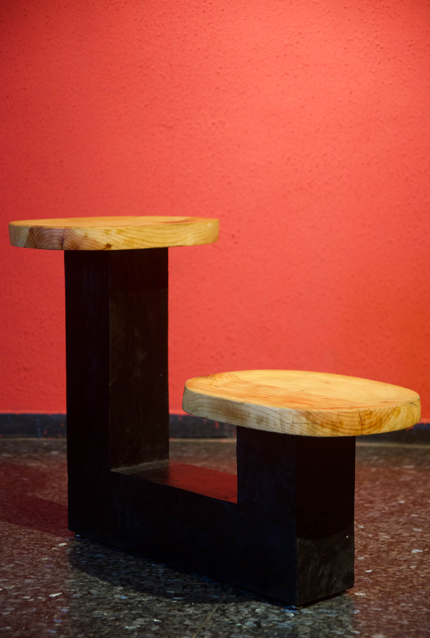 layered stools with wooden tabletop