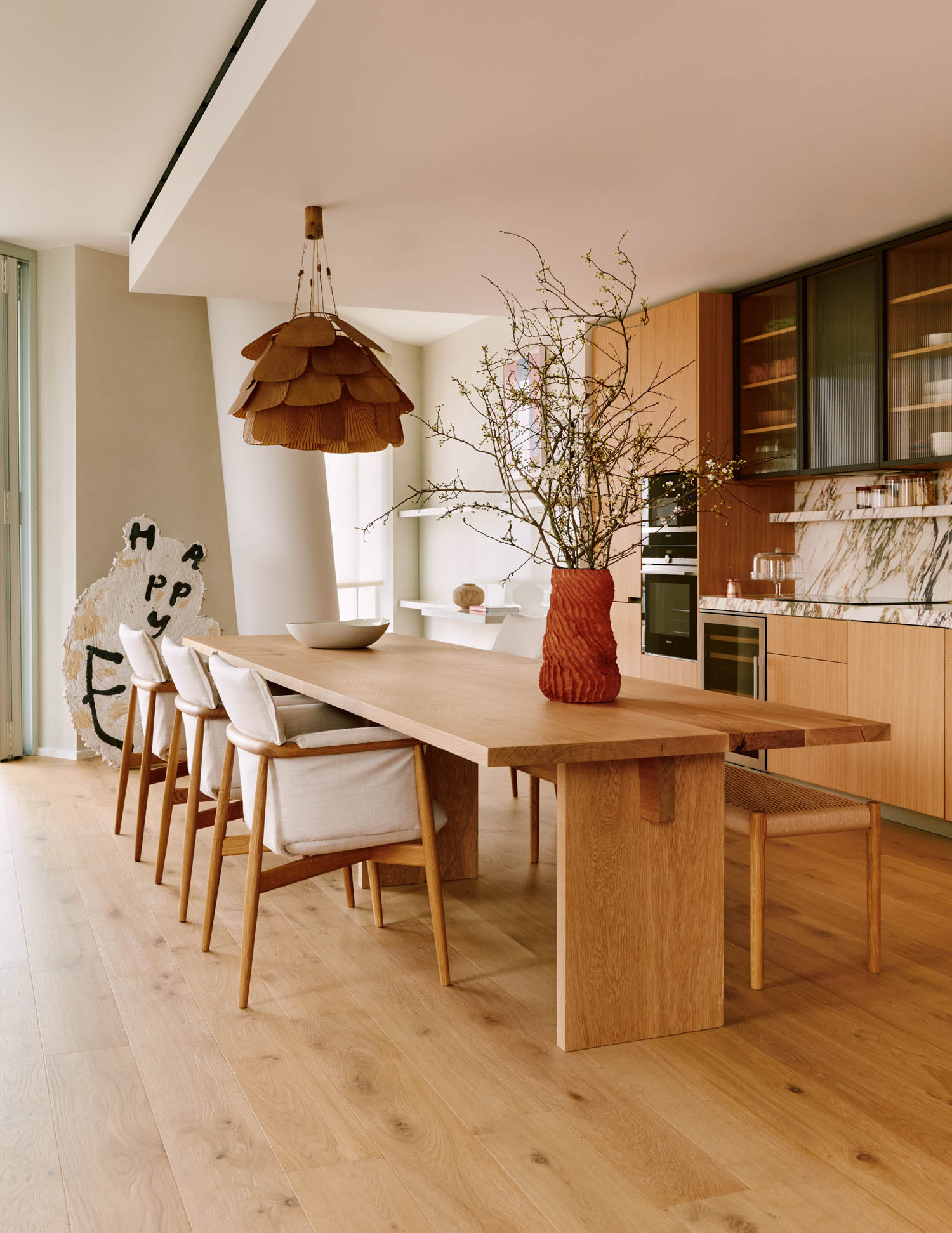 dining and kitchen space with warm oak table and accents
