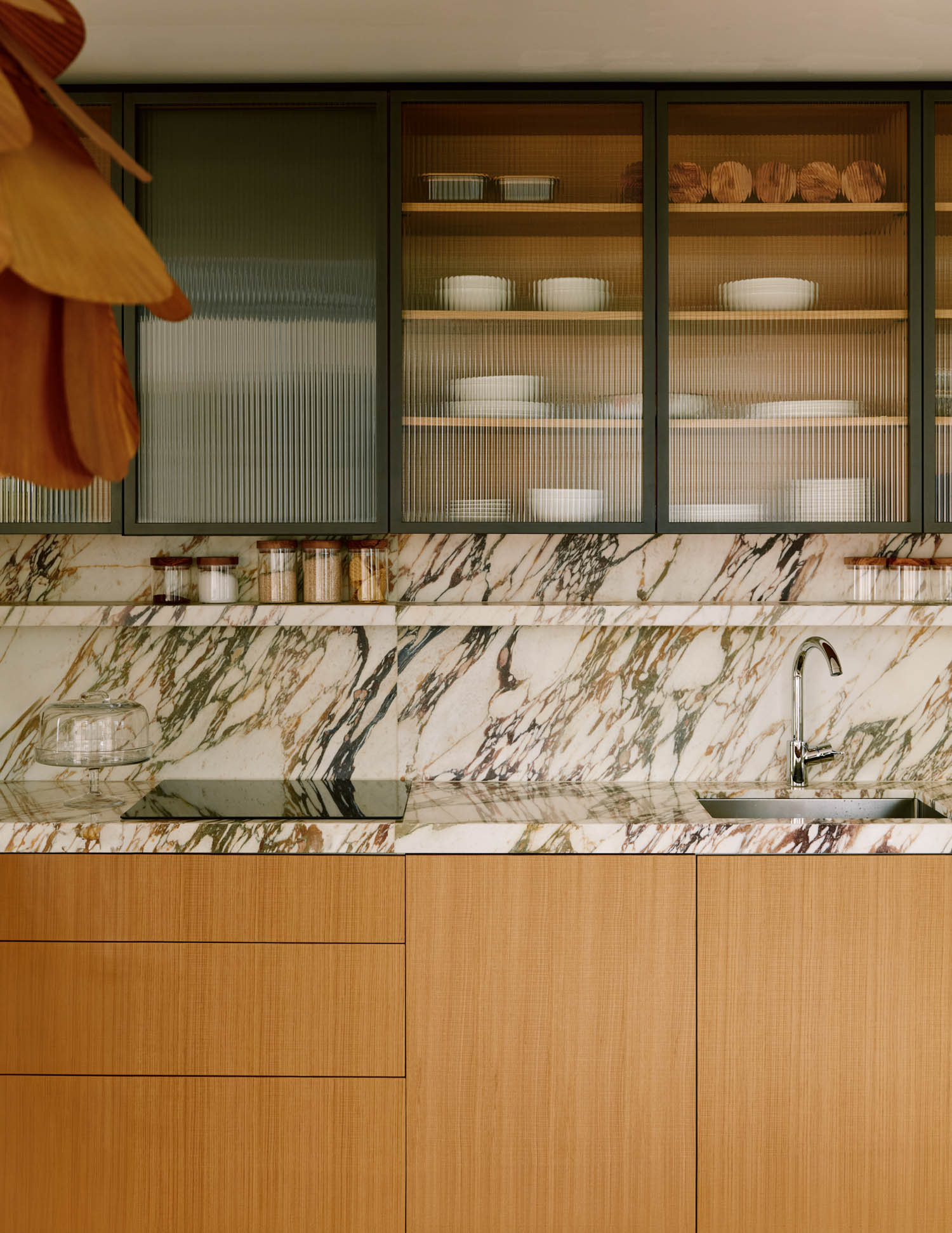 kitchen backsplash with marble and shelves with dishes