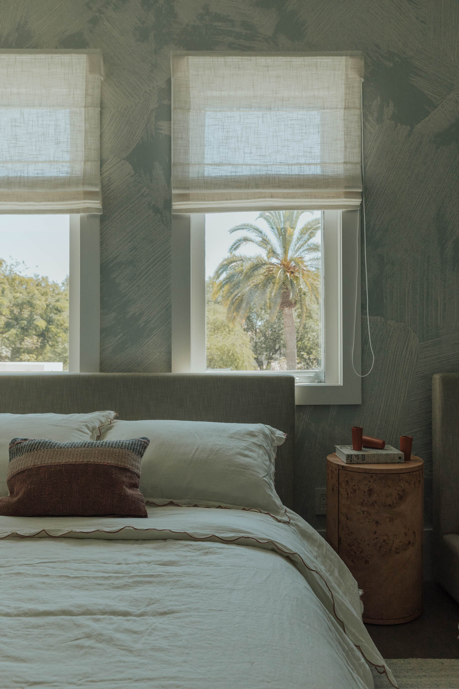 bedroom with light blue patterned wallpaper