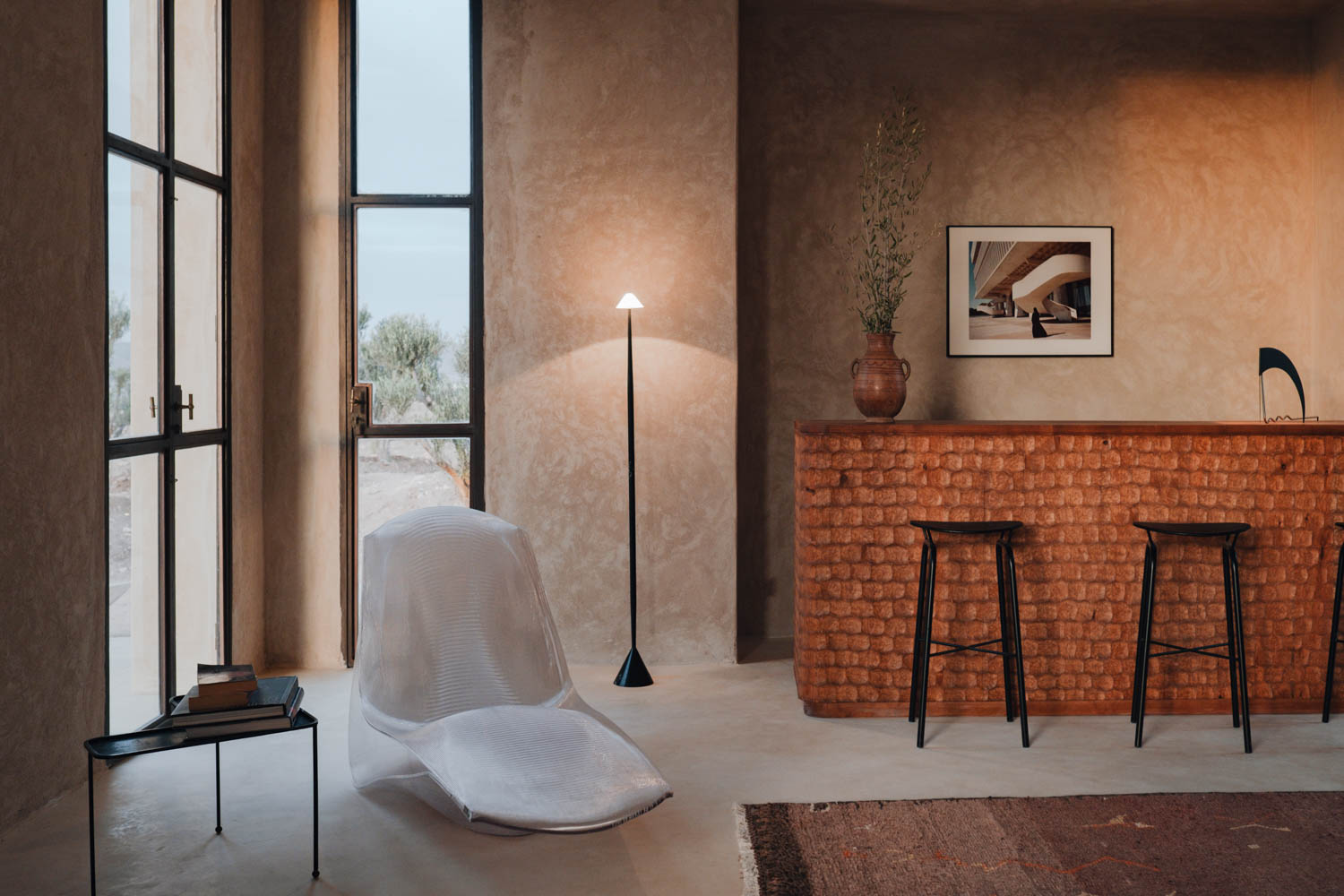 bar area with long brown table and white chair