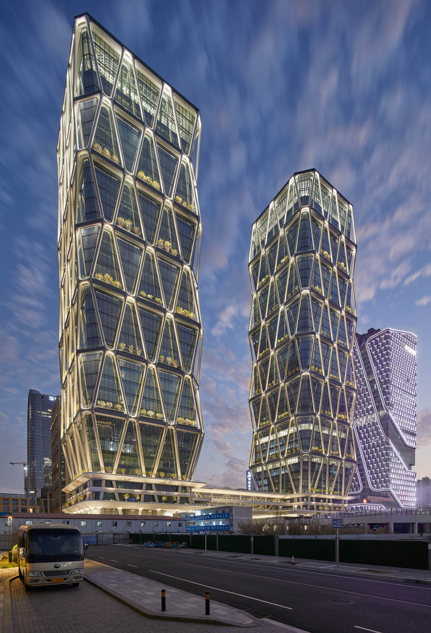 two lit up towers in Asia