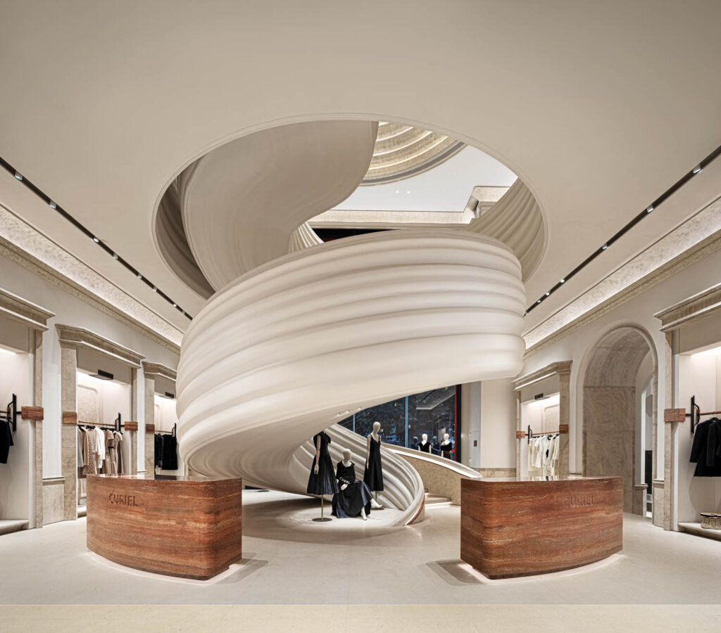 a large white staircase in Casa Curiel showroom