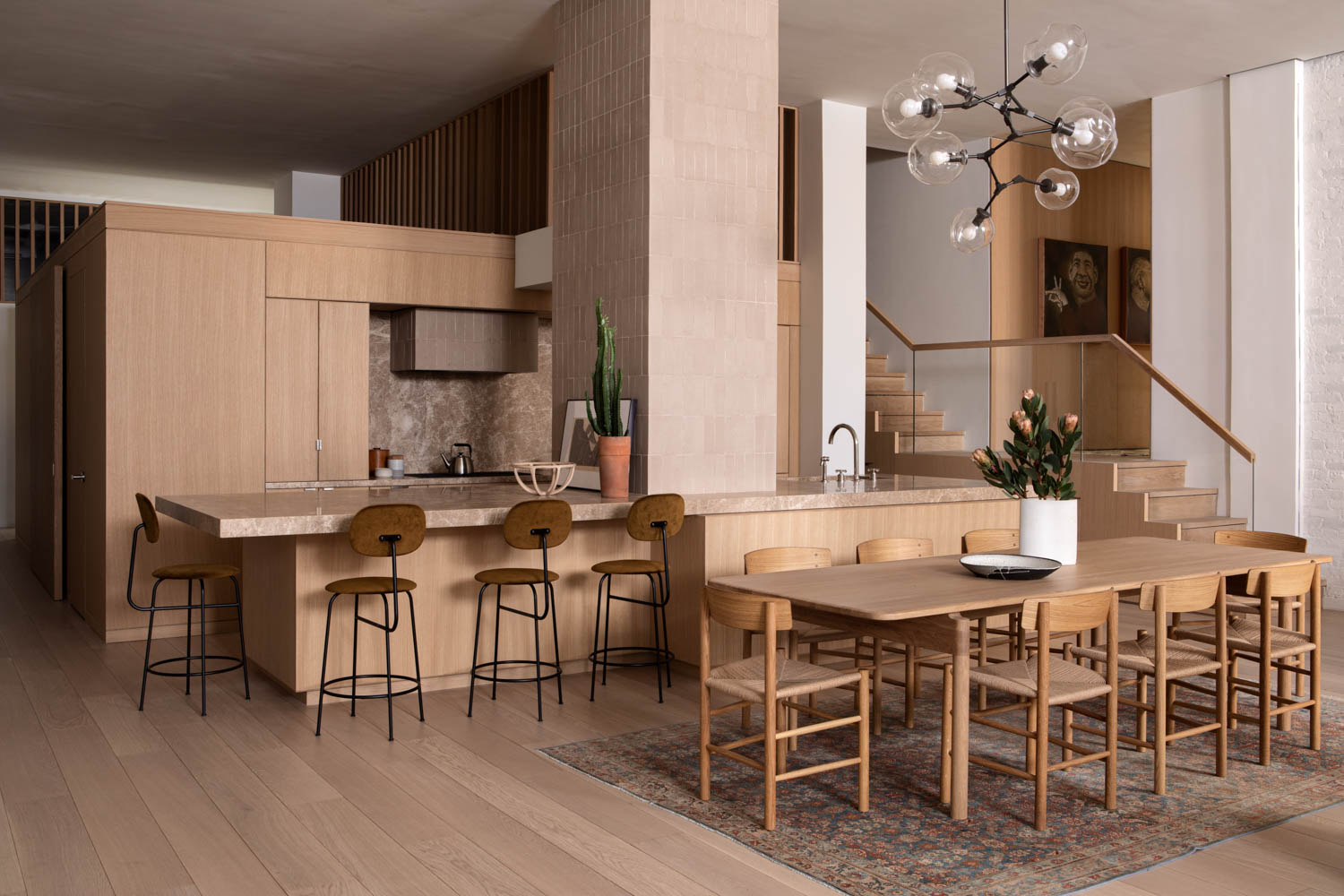 kitchen space with wooden chairs and cabinetry