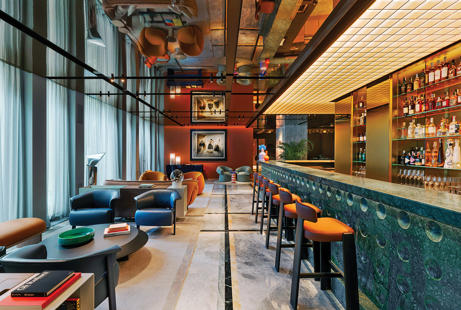 A bar with a marble counter and a bar with a bar stool.