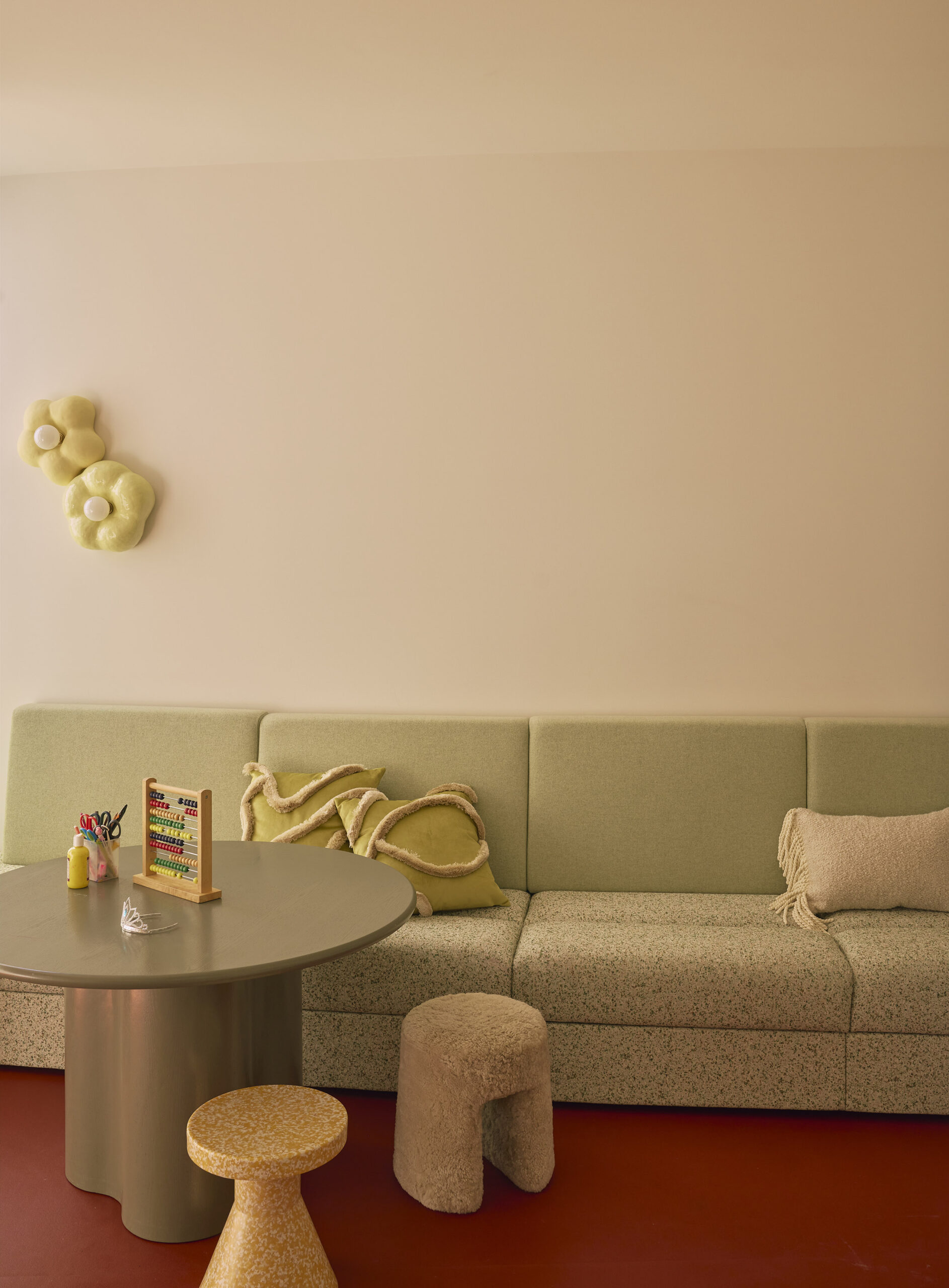 children's playroom with couch and rubber flooring