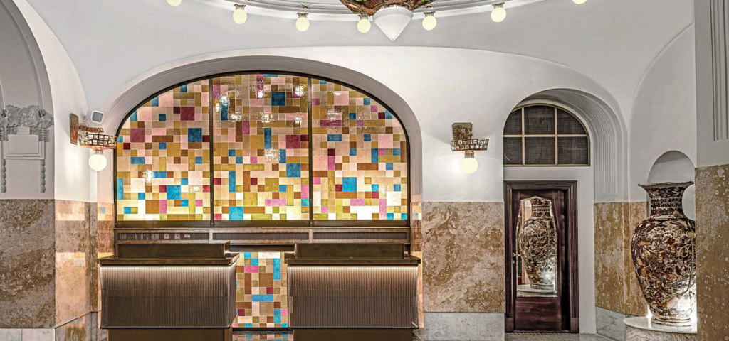 check in desk with colorful mosaics