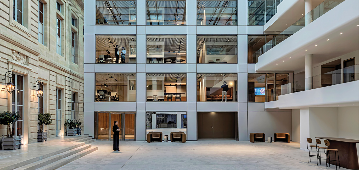 person standing at base of workplace