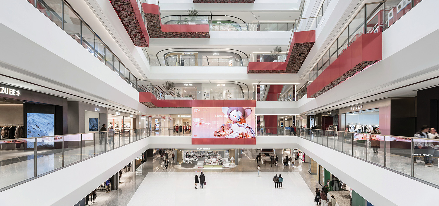 interior of a mall with red balconies